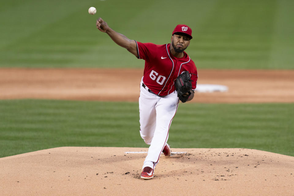 Washington Nationals starting pitcher Joan Adon delivers during the first inning of the second game of a baseball doubleheader against the Atlanta Braves, Sunday, Sept. 24, 2023, in Washington. (AP Photo/Stephanie Scarbrough)