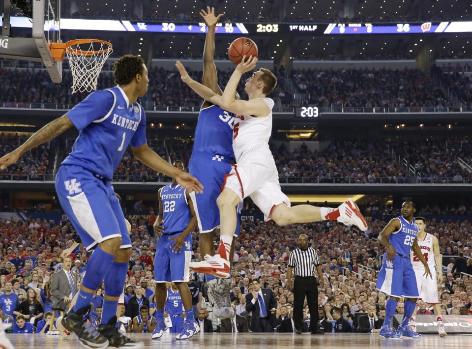 Wisconsin forward Sam Dekker (15) shoots against Kentucky forward Julius Randle (30) during the first half of the NCAA Final Four tournament college basketball semifinal game Saturday, April 5, 2014, in Arlington, Texas. (AP Photo/David J. Phillip)