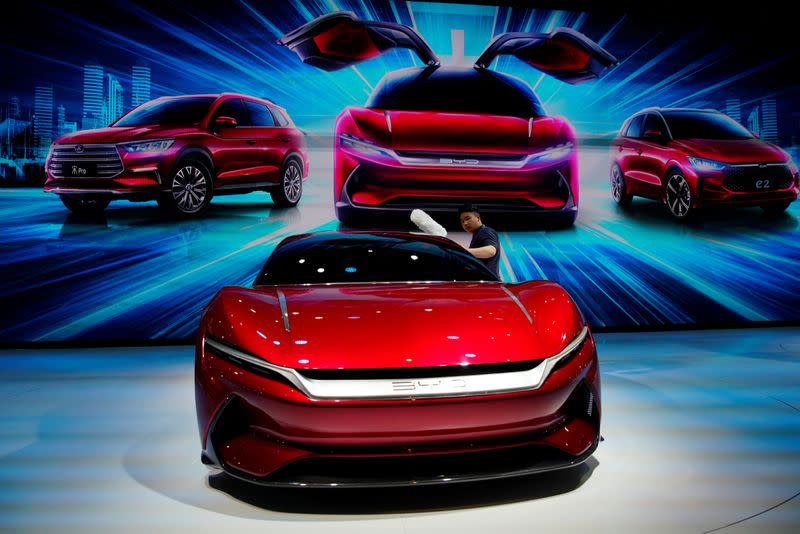 FILE PHOTO: Man cleans a BYD e-SEED GT concept EV during the media day for the Shanghai auto show in Shanghai