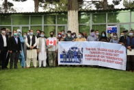 In this Friday, April 30, 2021, photo former Afghan interpreters hold placards during a protest against the U.S. government and NATO in Kabul, Afghanistan. (AP Photo/Mariam Zuhaib)