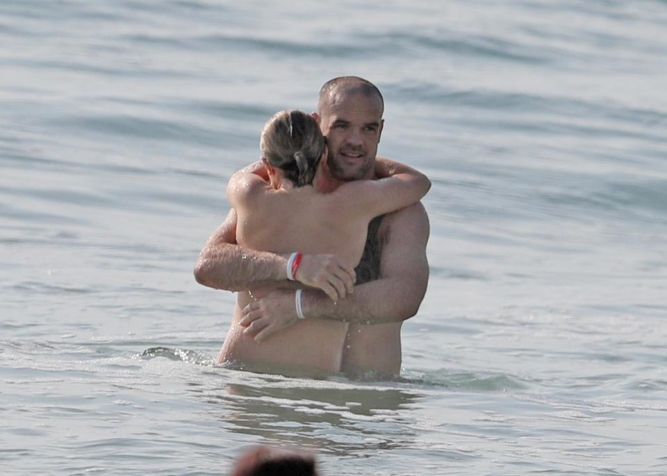 Tess and Nate, who married in 2011, were seen splashing about in the waves.