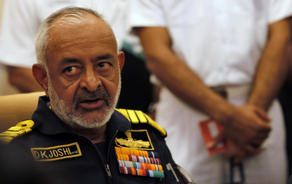 FILE - In this Wednesday, Aug. 14, 2013 file photo, India's navy chief Admiral D.K. Joshi watches at a press conference in Mumbai, India. Joshi resigned Wednesday hours after seven sailors were overcome with smoke on an Indian navy submarine, and two other sailors were missing in an accident off Mumbai’s coast. (AP Photo/Rajanish Kakade, File)