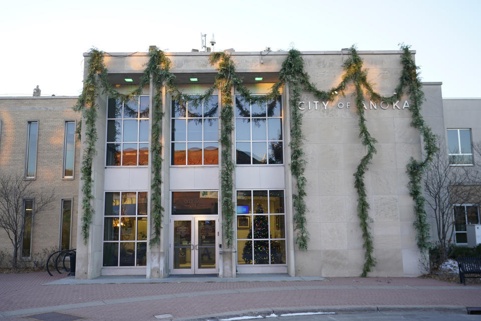 FILE - The Anoka City Hall is pictured Tuesday, Dec. 12, 2023, in Anoka, Minn. The U.S. Department of Justice and the city of Anoka, Minn., a Minneapolis suburb, have reached an agreement to resolve allegations from the Department that the city's enforcement of a "crime-free" housing ordinance discriminated against people with mental illnesses by encouraging landlords to evict them if there were too many emergency services calls to their homes or apartments. (AP Photo/Abbie Parr, File)