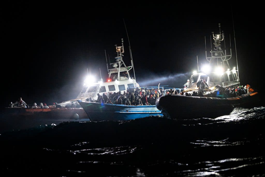 Migrants are rescued off the coast of Lampedusa, Italy, 24 January 2022 (AP)