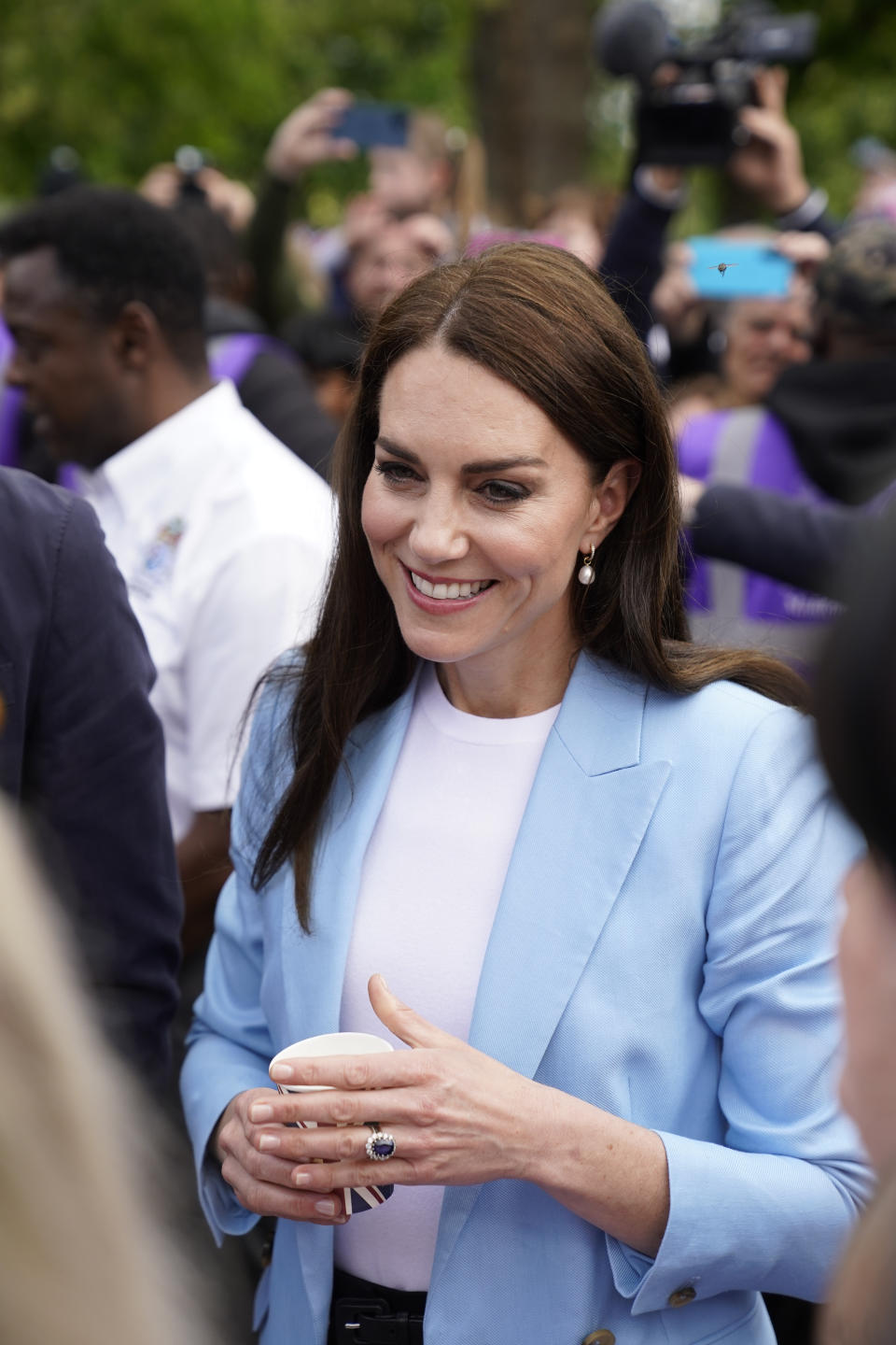 WINDSOR, ENGLAND - MAY 07:  Catherine, Princess of Wales smiles during a walkabout meeting members of the public on the Long Walk near Windsor Castle, where the Coronation Concert to celebrate the coronation of King Charles III and Queen Camilla is being held this evening on May 7, 2023 in Windsor, England. The Coronation of Charles III and his wife, Camilla, as King and Queen of the United Kingdom of Great Britain and Northern Ireland, and the other Commonwealth realms took place yesterday at Westminster Abbey today. Charles acceded to the throne on 8 September 2022, upon the death of his mother, Elizabeth II.  (Photo by Andrew Matthews-WPA Pool/Getty Images)