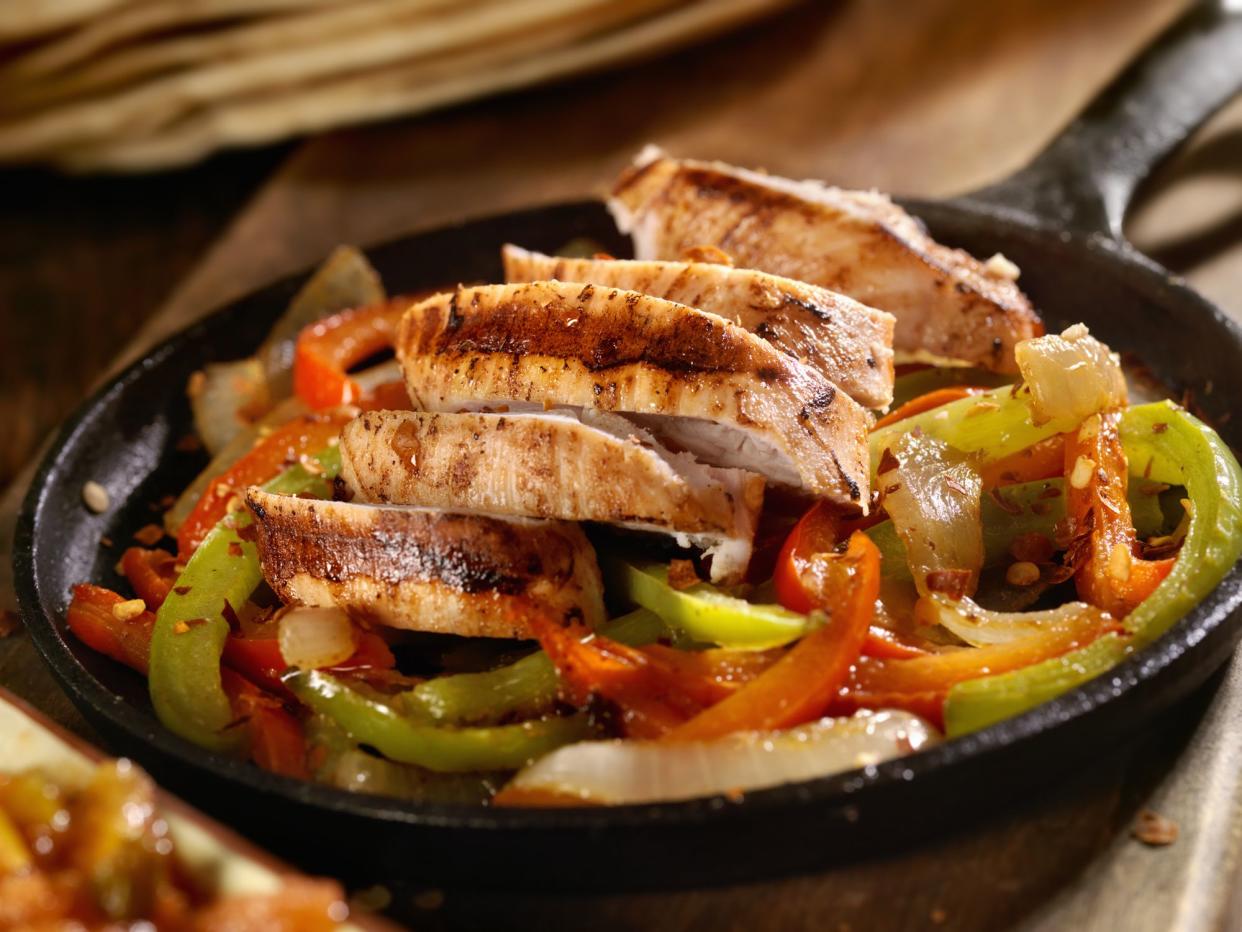 Grilled Chicken Fajitas with Peppers in a Cast Iron Skillet - Photographed on Hasselblad H3D2-39mb Camera