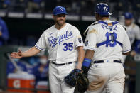 Kansas City Royals relief pitcher Greg Holland (35) celebrates with catcher Salvador Perez (13) following a baseball game against the Los Angeles Angels at Kauffman Stadium in Kansas City, Mo., Tuesday, April 13, 2021. The Royals defeated the Angels 3-2. (AP Photo/Orlin Wagner)