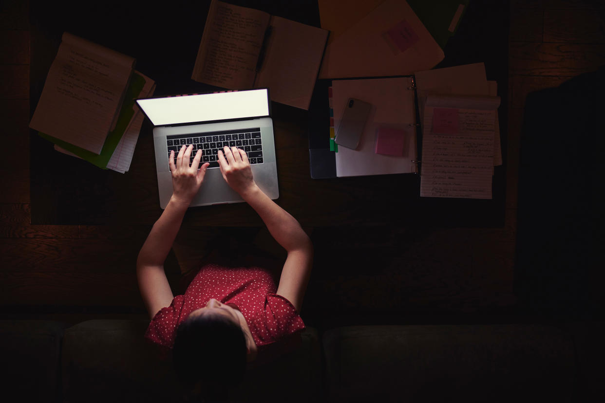 Woman working from home late at night