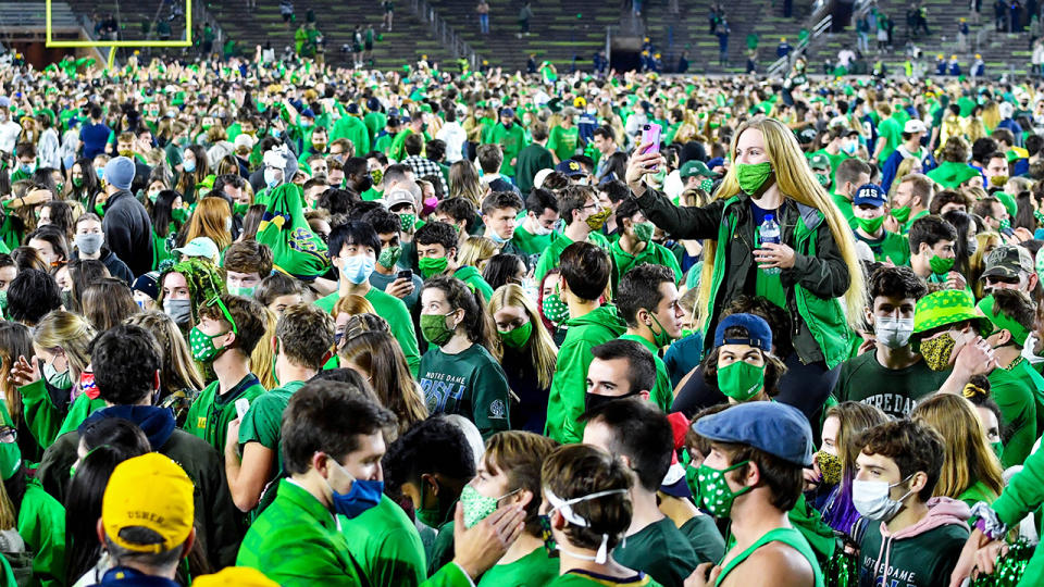 Fans, pictured here on the field after Notre Dame defeated Clemson.