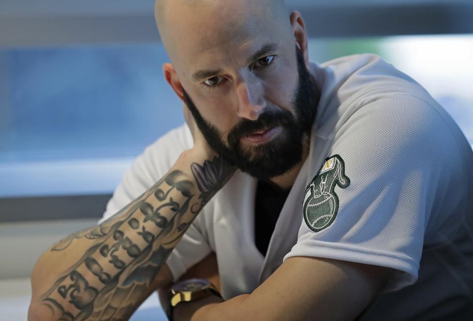 Oakland Athletics pitcher Mike Fiers ponders a question during an interview with the media on Friday, Jan. 24, 2020, in Oakland, Calif. Fiers, the Oakland pitcher and whistleblower in the Houston Astros sign-stealing scandal, appeared with teammates and manager Bob Melvin at team offices. Fiers has not spoken publicly about the sign stealing since the story was published in The Athletic in November. (AP Photo/Ben Margot)