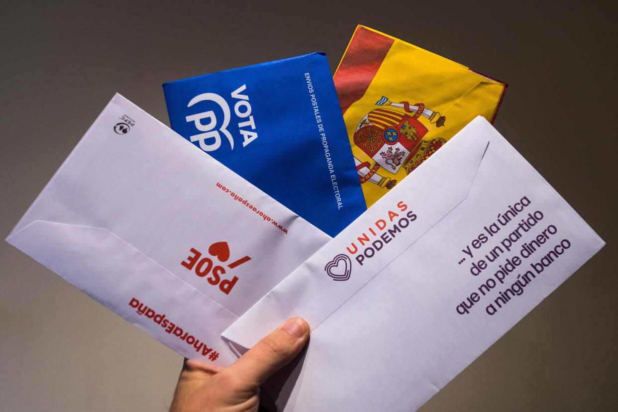 MADRID, SPAIN - 2019/11/07: In this photo illustration, the hand of a man showing postal mail of some of the main Spanish political parties (PSOE, PP, VOX, Unidas Podemos) that contains the ballots to vote in the next general elections that will take place on November 10 in Spain. (Photo Illustration by Marcos del Mazo/LightRocket via Getty Images)