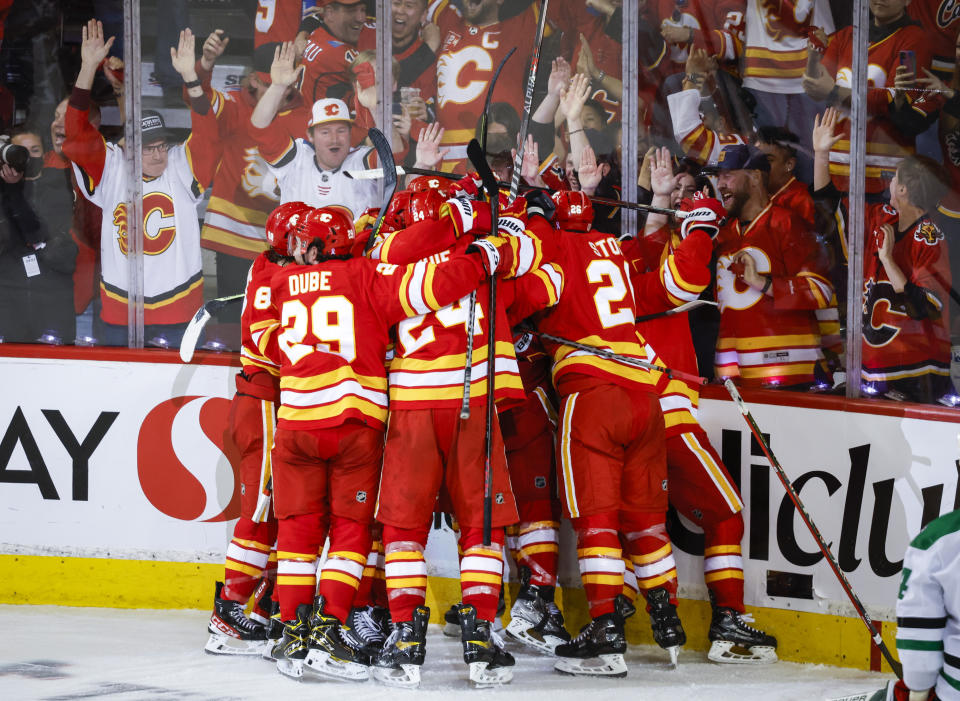 Calgary Flames celebrate defeating the Dallas Stars in overtime NHL playoff hockey action in Calgary, Alberta, Sunday, May 15, 2022. (Jeff McIntosh/The Canadian Press via AP)