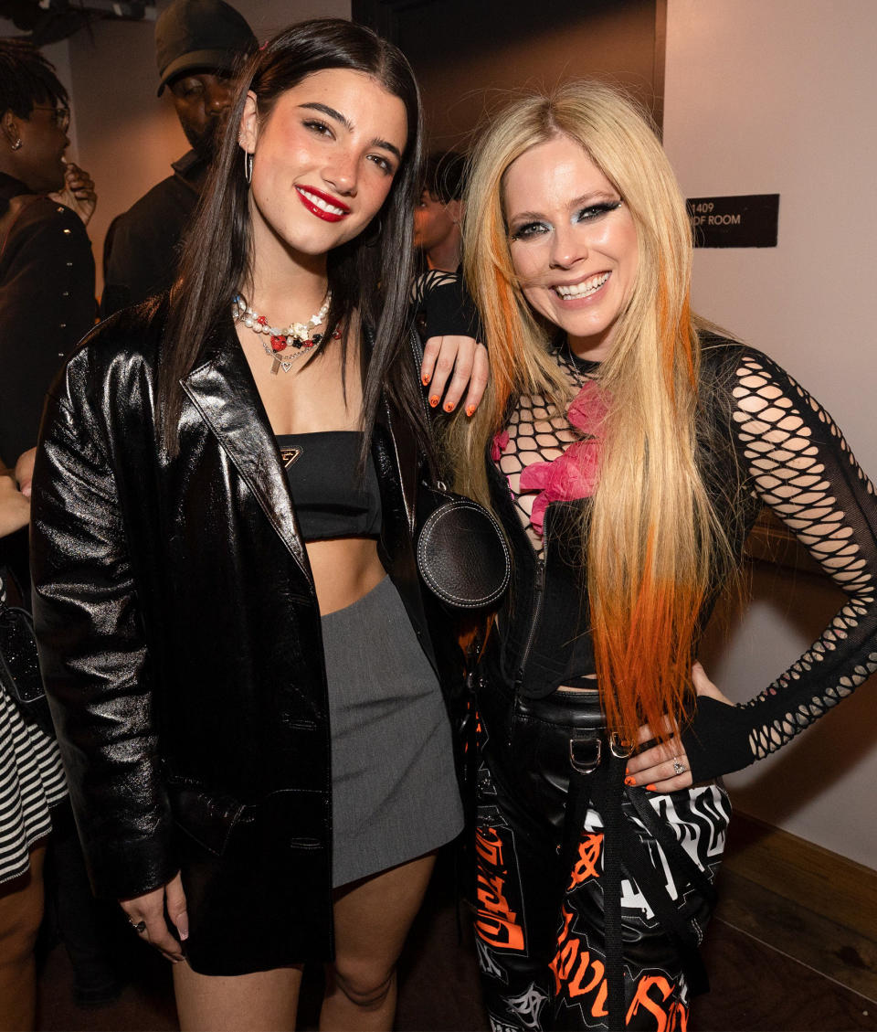 <p>Charli D'Amelio meets up with Avril Lavigne backstage at Machine Gun Kelly's L.A. concert on July 14. </p>