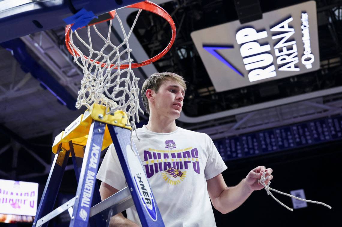 Lyon County’s Travis Perry cuts a part of the net after defeating Harlan County in the KHSAA boys’ basketball championship game at Rupp Arena on March 23. Perry will play for Kentucky next season.