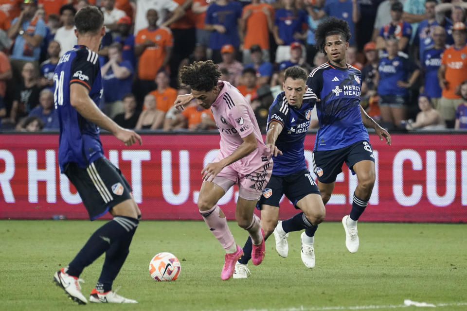 Inter Miami midfielder David Ruiz, left, tries to regain possession as FC Cincinnati defender Santiago Arias, second from right, commits a foul during extra time in a U.S. Open Cup soccer semifinal Wednesday, Aug. 23, 2023, in Cincinnati. (AP Photo/Joshua A. Bickel)