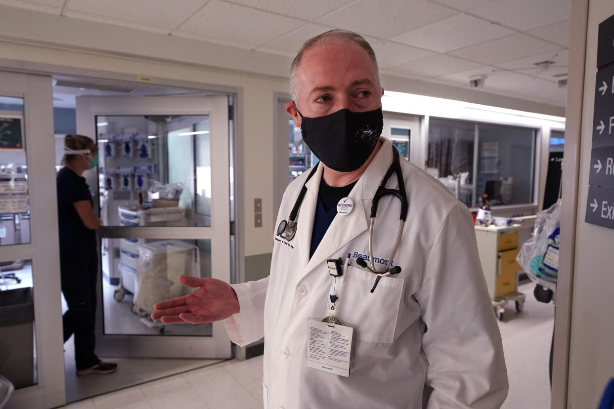 Dr. Paul Bozyk, assistant chief of critical care and pulmonary medicine at the William Beaumont hospital is interviewed at the hospital in Royal Oak, Mich. Michigan has become the current national hotspot for COVID-19 infections and hospitalizations at a time when more than half the U.S. adult population has been vaccinated and other states have seen the virus diminish substantially. “A year ago, the phrase was tsunami,” said Bozyk. “It was chaotic. People were overwhelmed with what they were seeing: Death and dying. This year, it’s more of a slow, rising flood. No big surge of patients, but we keep getting more each day. We’re full.” (AP Photo/Carlos Osorio)