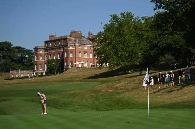 A golfer attempting to putt on a green at Brocket Hall Golf Club in Hertfordshire