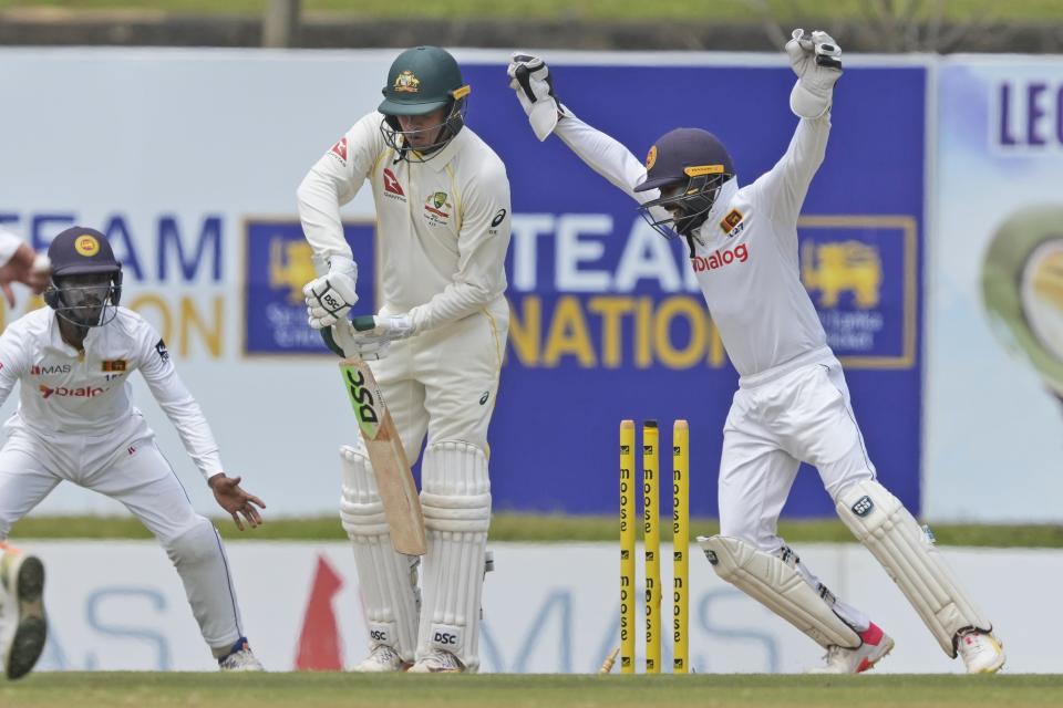 Australia's Usman Khawaja is bowled out by Sri Lanka's Ramesh Mendis during the first day of the second cricket test match between Australia and Sri Lanka in Galle, Sri Lanka, Friday, July 8, 2022. (AP Photo/Eranga Jayawardena)