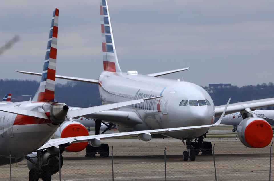 These are some of the 88 American Airlines planes stored at Pittsburgh International Airport in Imperial, Pa., on Tuesday, March 31, 2020. As airlines cut more service, due to the COVID-19 pandemic, Pittsburgh International Airport has closed one of its four runways to shelter in place 96 planes, mostly from American Airlines, as of Monday, March 30, 2020. The airport has the capacity to store 140 planes.(AP Photo/Gene J. Puskar)