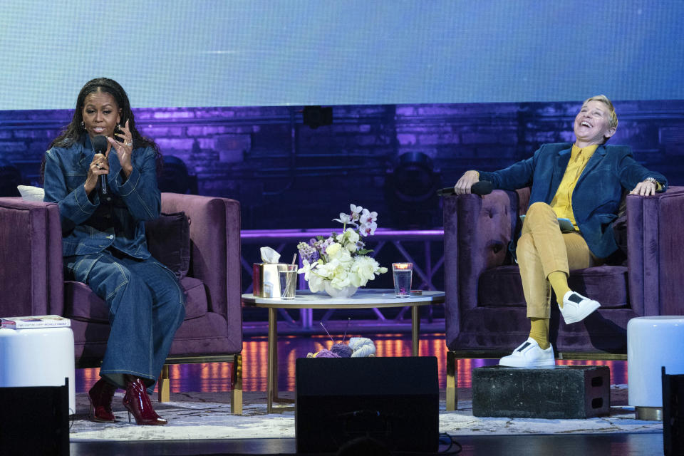 Michelle Obama accompanied by Ellen DeGeneres speaks to the crowd as she launches her new book “The Light We Carry: Overcoming in Uncertain Times.” at Warner Theater in Washington, Tuesday, Nov. 15, 2022. ( AP Photo/Jose Luis Magana)