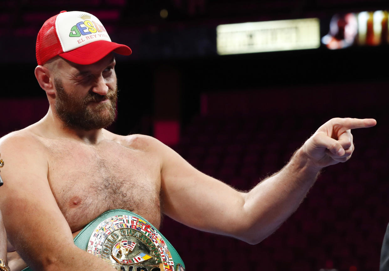 Tyson Fury with his belt during a press conference after winning the fight against Deontay Wilder REUTERS/Steve Marcus