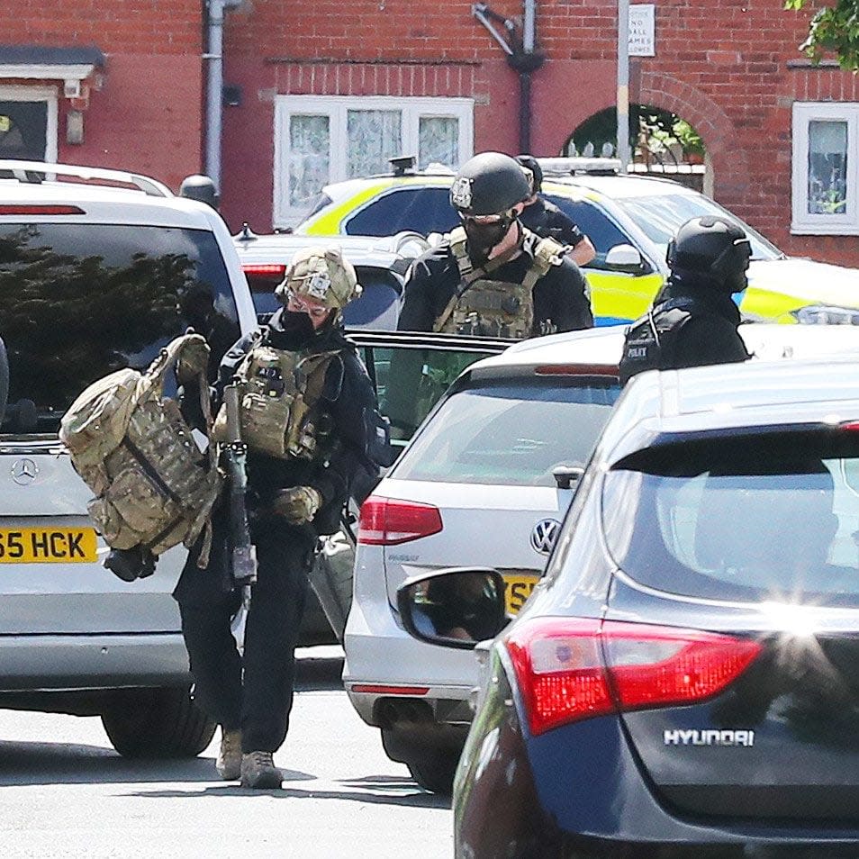 Police raid a house on Elsmore Rd in Fallowfield, South Manchester  - Credit:  Eamonn and James Clarke