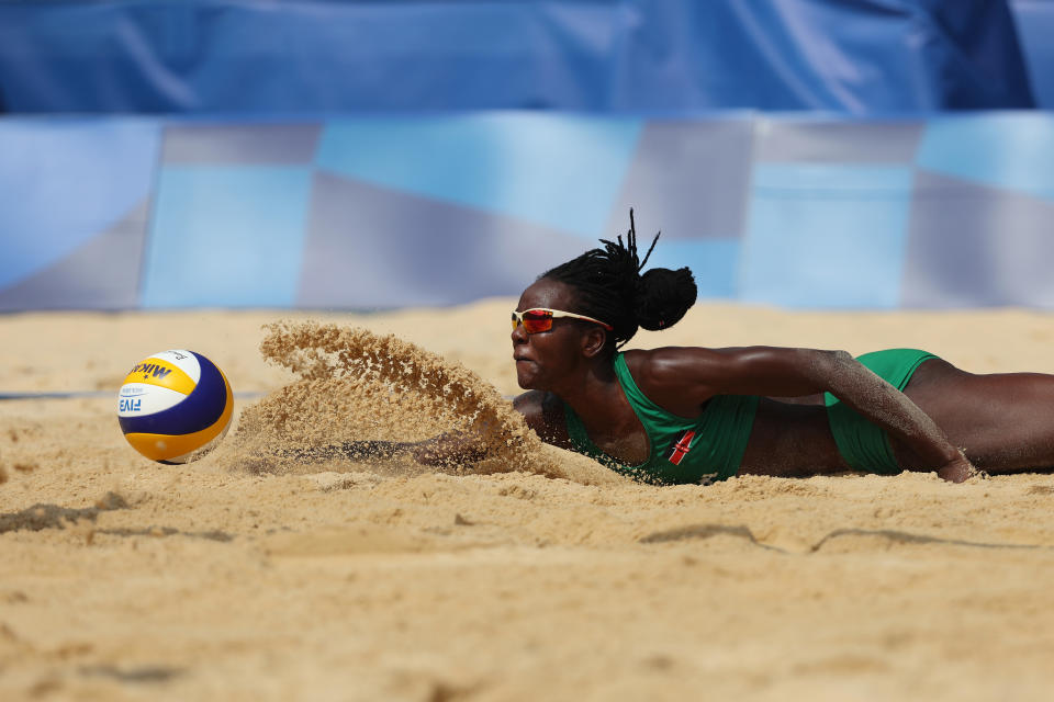 <p>Gaudencia Makokha #1 of Team Kenya attempts to dive for the ball against Team United States during the Women's Preliminary - Pool D beach volleyball on day six of the Tokyo 2020 Olympic Games at Shiokaze Park on July 29, 2021 in Tokyo, Japan. (Photo by Sean M. Haffey/Getty Images)</p> 