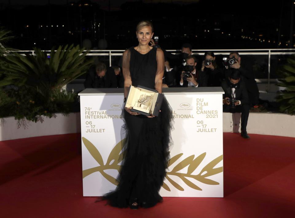 Director Julia Ducournau, winner of the Palme d'Or for the film 'Titane' poses for photographers during a photo call following the awards ceremony at the 74th international film festival, Cannes, southern France, Saturday, July 17, 2021. (Photo by Vianney Le Caer/Invision/AP)