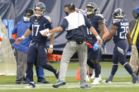 Tennessee Titans head coach Mike Vrabel celebrates with quarterback Ryan Tannehill (17) after a touchdown against the Houston Texans in the first half of an NFL football game Sunday, Oct. 18, 2020, in Nashville, Tenn. (AP Photo/Mark Zaleski)