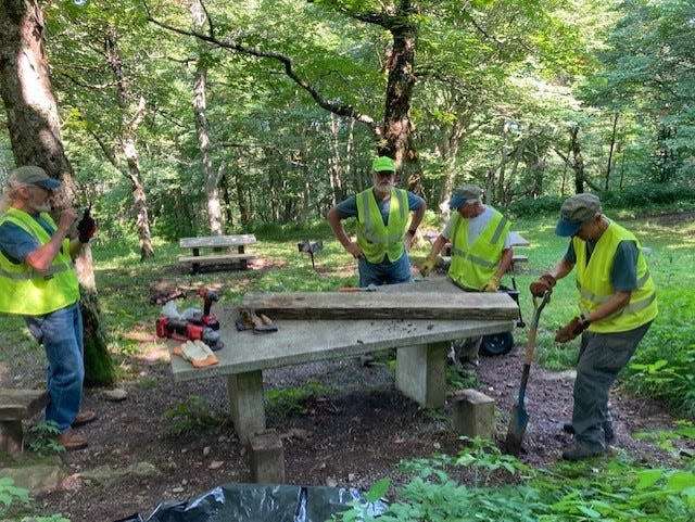 Restoration workers at the Craggy picnic area on the Blue Ridge Parkway replaced missing seat benches, straightened supporting pedestals and removed dangerous tables, in an effort to ensure the area is safe and welcoming to visitors.