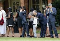 Mourners stand in line as they wait to enter the memorial service for Maya Angelou at Wake Forest University in Winston-Salem, North Carolina June 7, 2014. REUTERS/Nell Redmond