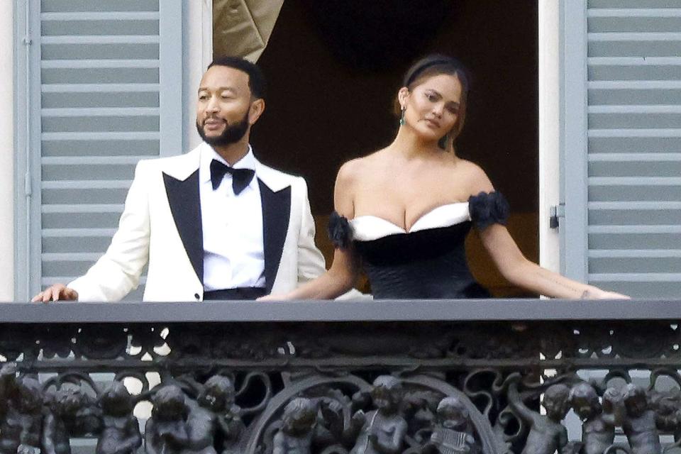 <p>Pedro Elena / SplashNews.com</p> John Legend and Chrissy Teigen pose on the balcony of Villa Pizzo in Lake Como, Italy, during their 10-year wedding anniversary celebrations