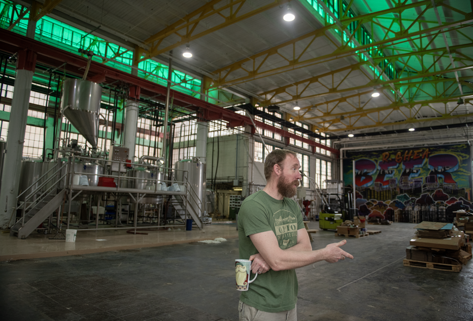 Ron Shea, owner of the now-closed R. Shea Brewing in Akron, stands in the former space for special events in the brewery's Canal Place location on March 7. Shea and employees have cleared out the building in preparation to auction off items.