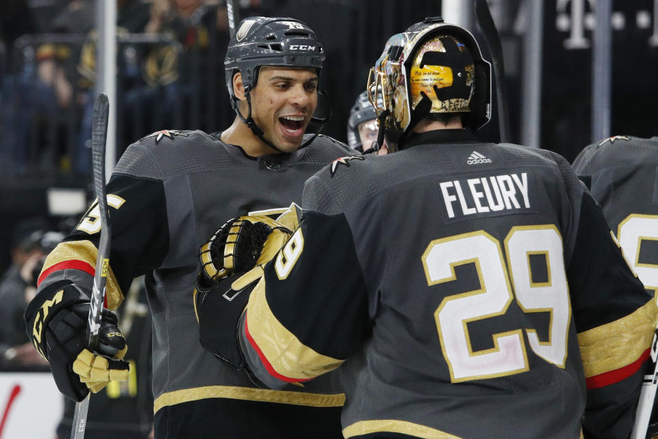 Vegas Golden Knights' Ryan Reaves, left, celebrates with goaltender Marc-Andre Fleury after defeating the Edmonton Oilers in an NHL hockey game Wednesday, Feb. 26, 2020, in Las Vegas. (AP Photo/John Locher)