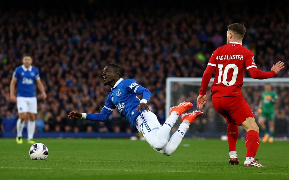 Everton's Idrissa Gueye in action with Liverpool's Alexis Mac Allister