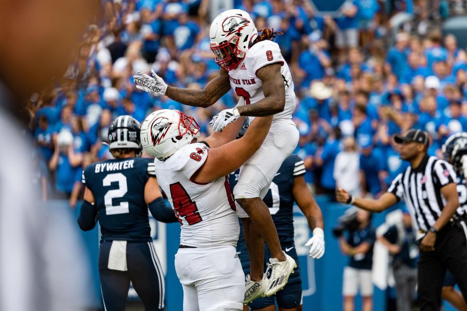 Southern Utah Thunderbirds offensive lineman Kyle Sfarcioc (64) and Southern Utah Thunderbirds wide receiver Isaiah Wooden (8) celebrate Wooden’s touchdown against Brigham Young University at LaVell Edwards Stadium in Provo on Saturday, Sept. 9, 2023. | Megan Nielsen, Deseret News