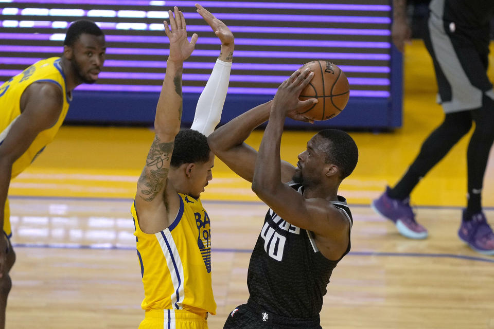 Sacramento Kings forward Harrison Barnes (40) shoots over Golden State Warriors forward Juan Toscano-Anderson (95) during the second half of an NBA basketball game on Sunday, April 25, 2021, in San Francisco. (AP Photo/Tony Avelar)