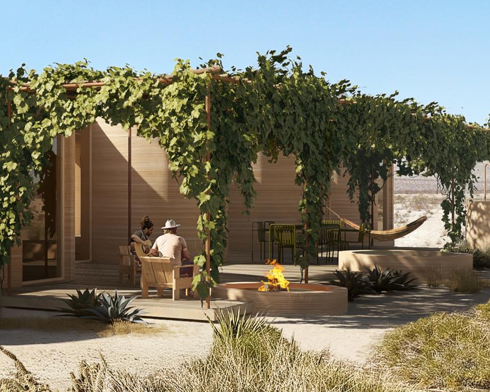 Renderings of the El Cosmico property shows people outside a printed structure.