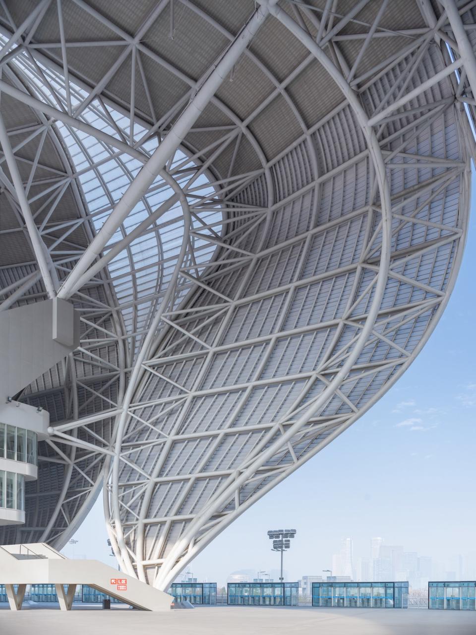 The steel shell is paired with a concrete seating bowl.