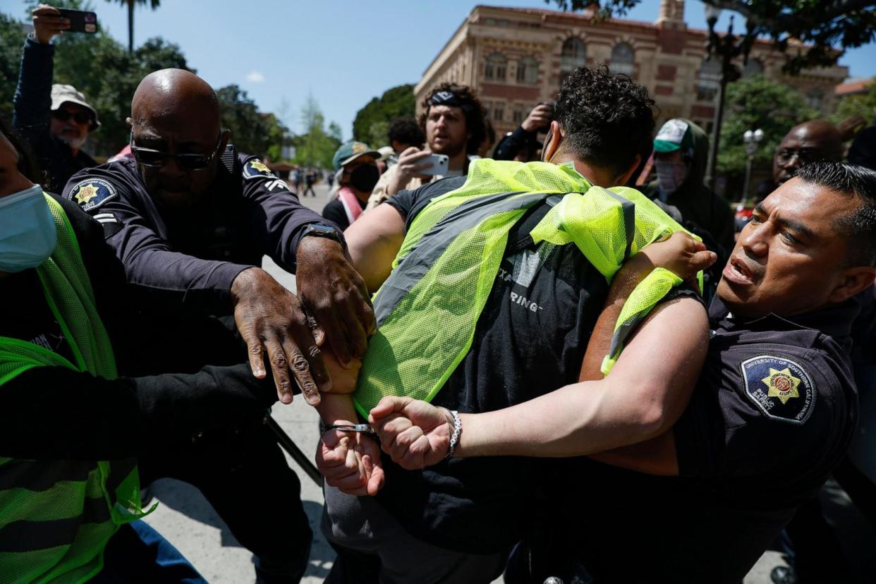 PHOTO: USC Public Safety Officers detain a protester during a Gaza solidarity occupation on campus to advocate for Palestine in Los Angeles, on April 24, 2024.  (Caroline Brehman/EPA via Shutterstock)