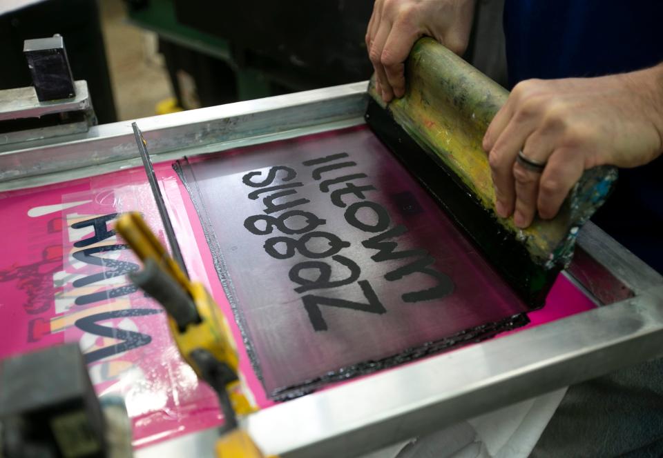 Mika Hon works on silkscreen project in the shop. NJ Ink Shop is a West Long Branch-based provider of custom, quality apparel and promotional products that was founded in 2011. Business partners/owners Michael "Mika" Hon and Javier Espinoza run the shop along with the shop dog Tandy. West Long Branch, NJMonday, March 13, 2023