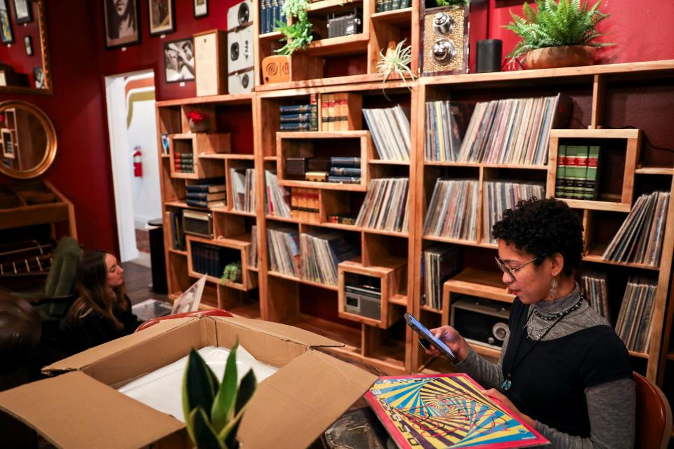 Barista Keara Watson sorts vinyl records in Offbeat Coffee’s record listening space on Jan. 19 in Salem.