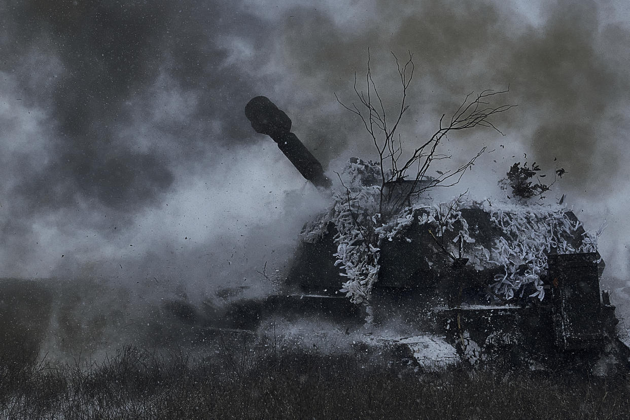 A self-propelled artillery vehicle fires on the frontline, Donetsk region, Ukraine, Saturday, Feb. 18, 2023. (AP Photo/Libkos)