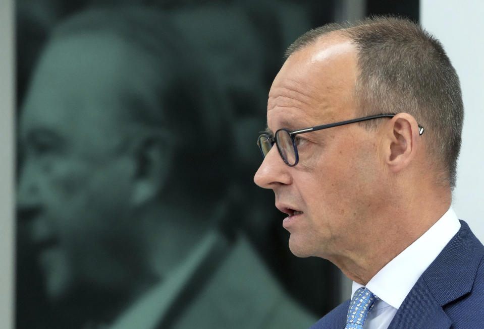 The Chairman of the German Christian Democratic Party (CDU), Friedrich Merz, addresses the media during a press conference at the party's headquarters in Berlin, Germany, Monday, May 16, 2022 the day after the state elections in the German state of North Rhine-Westphalia. In the background is a photo of the former German Chancellor Konrad Adenauer. (AP Photo/Michael Sohn)