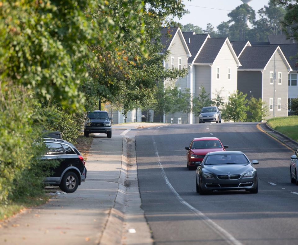 Overflow parking by residents and guests spills out along University Parkway on Thursday, Aug. 24, 2025. Escambia County leaders are considering a parking plan to address the issue.