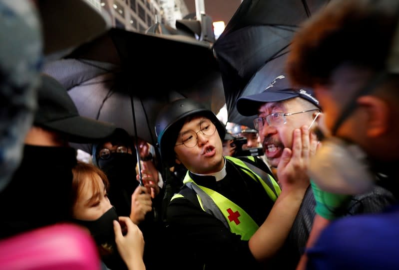 The Wider Image: Sermons with saline: Hong Kong pastor offers aid and prayers