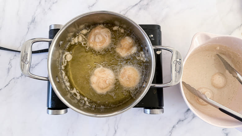 mushrooms frying in oil