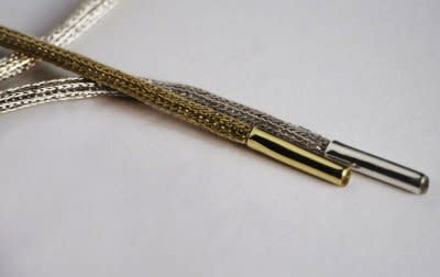 24K gold and silver shoelaces are the latest unnecessary luxury item. Photo courtesy of mr-kennedy.com