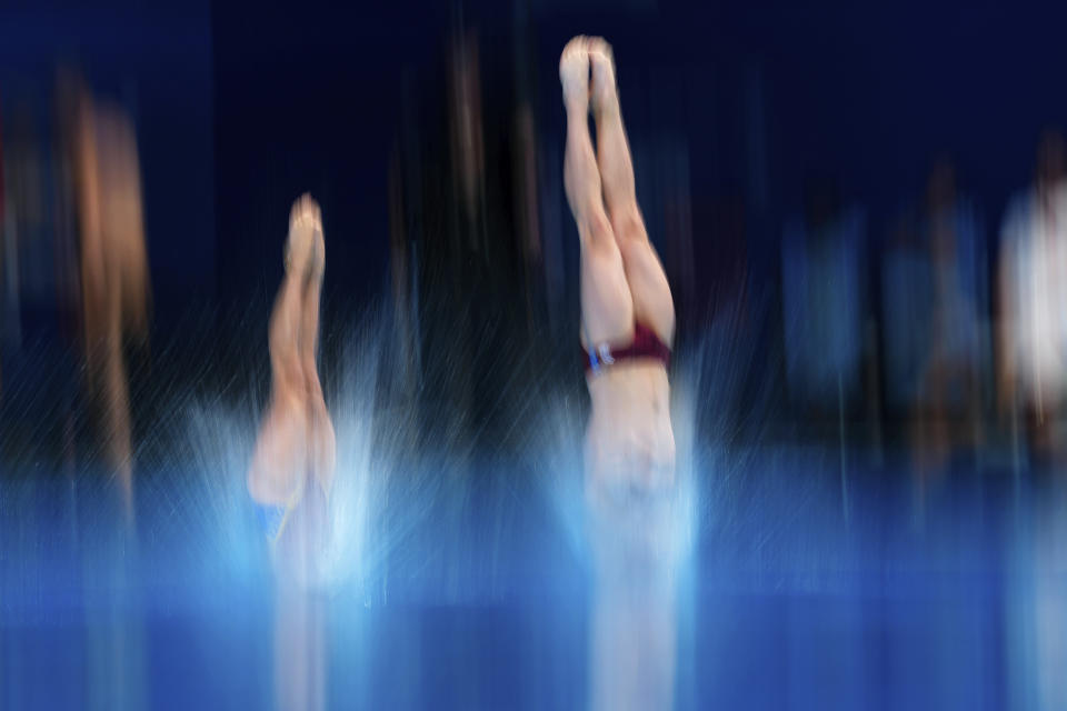 Kacper Lesiak and Aleksandra Blazowska of Poland compete during the mixed 3m synchronised diving final at the World Aquatics Championships in Doha, Qatar, Saturday, Feb. 10, 2024. (AP Photo/Hassan Ammar)