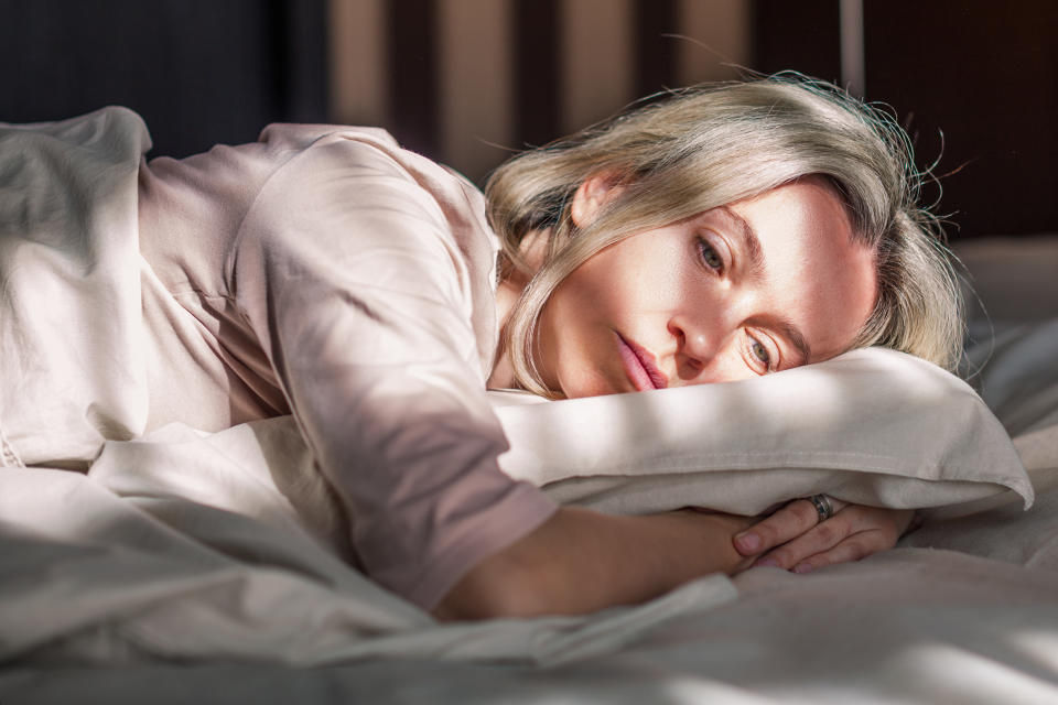 Woman with early menopause having sleep problems or insomnia. (Photo via Getty Images)